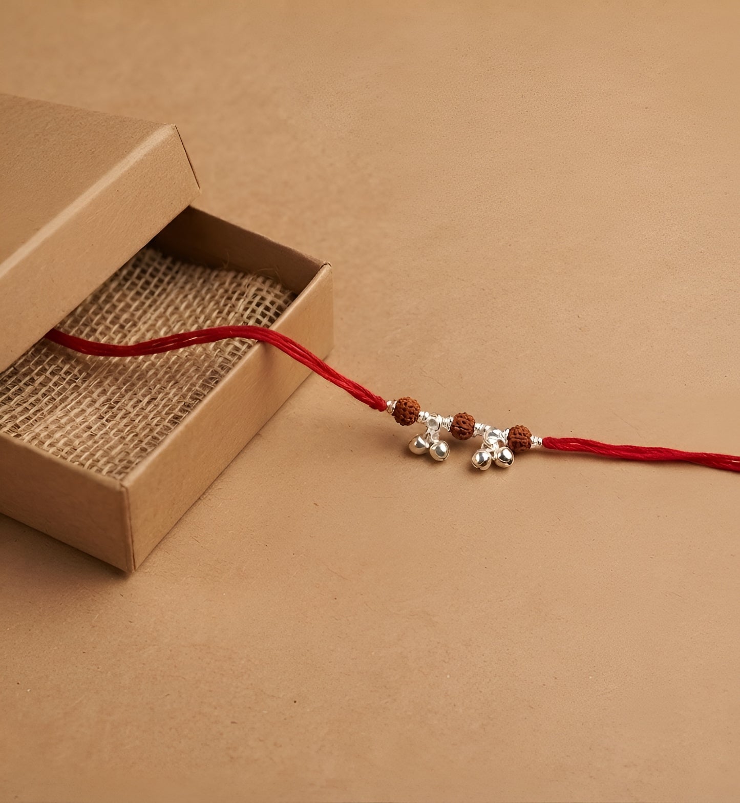 Elegant Rudraksha Silver Ghungroo Rakhi for Sister-in-Law