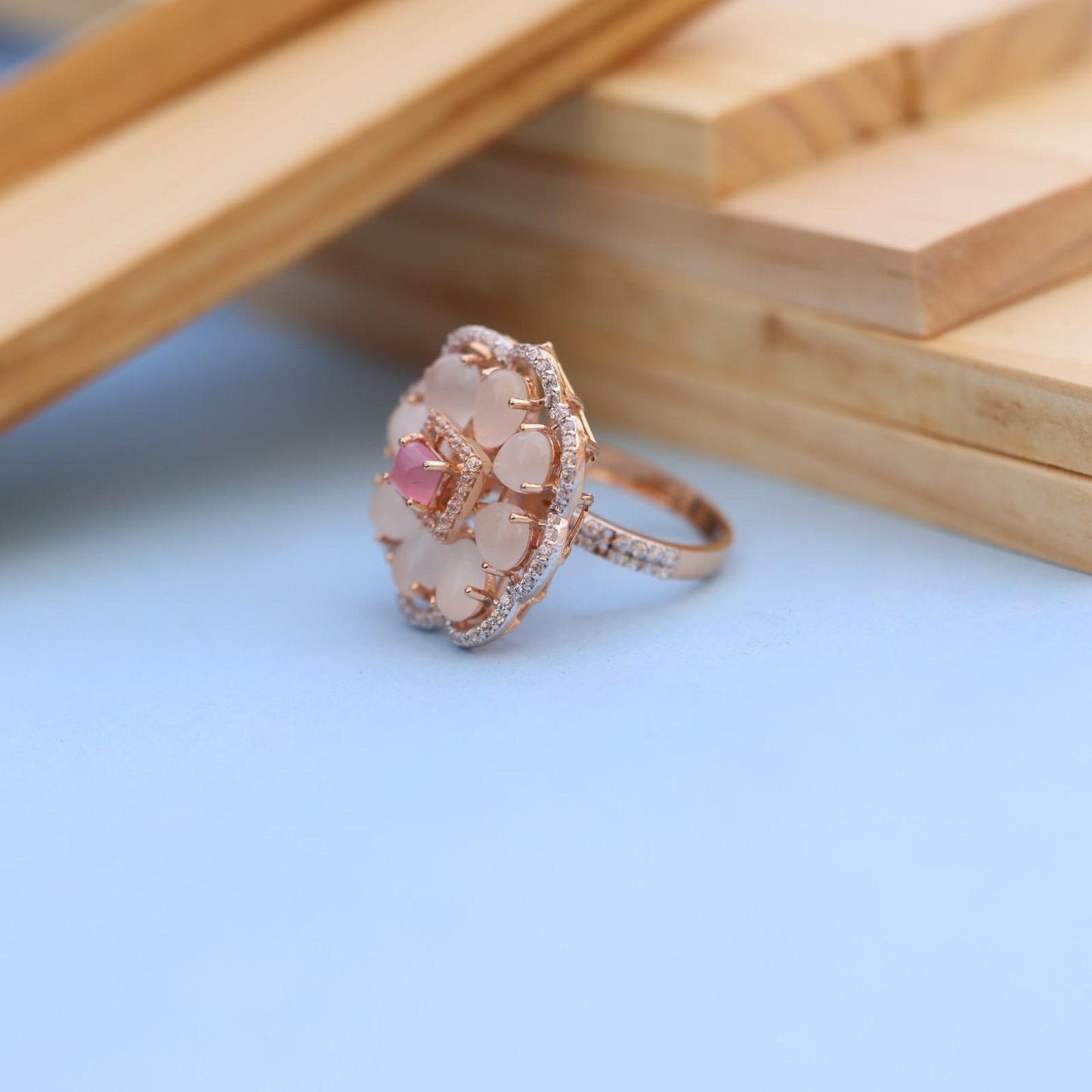 "Elegant Rose Gold Floral Ring with Pink Gemstone & White Accents"