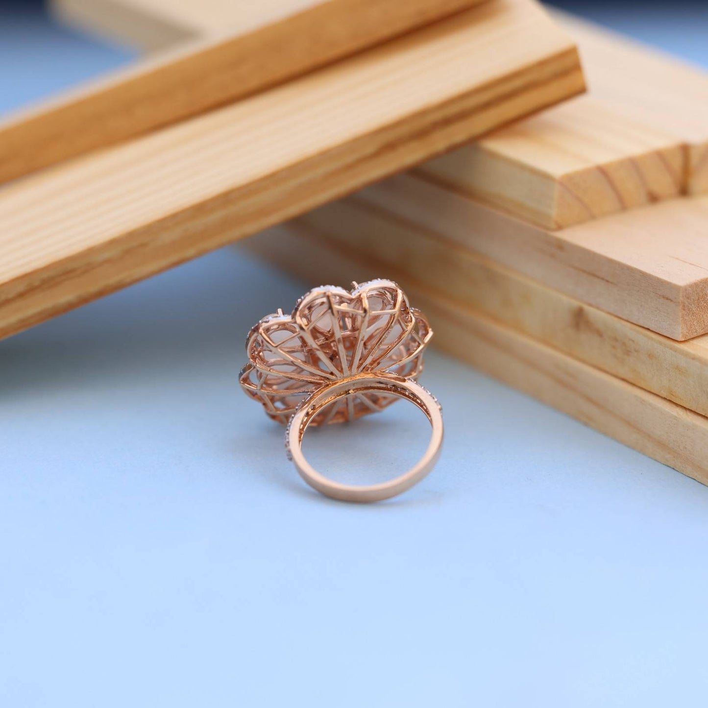 "Elegant Rose Gold Floral Ring with Pink Gemstone & White Accents"