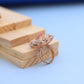 "Elegant Rose Gold Floral Ring with Pink Gemstone & White Accents"