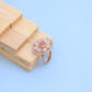 "Elegant Rose Gold Floral Ring with Pink Gemstone & White Accents"