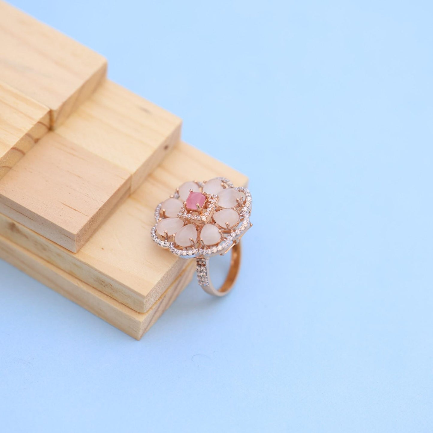 "Elegant Rose Gold Floral Ring with Pink Gemstone & White Accents"
