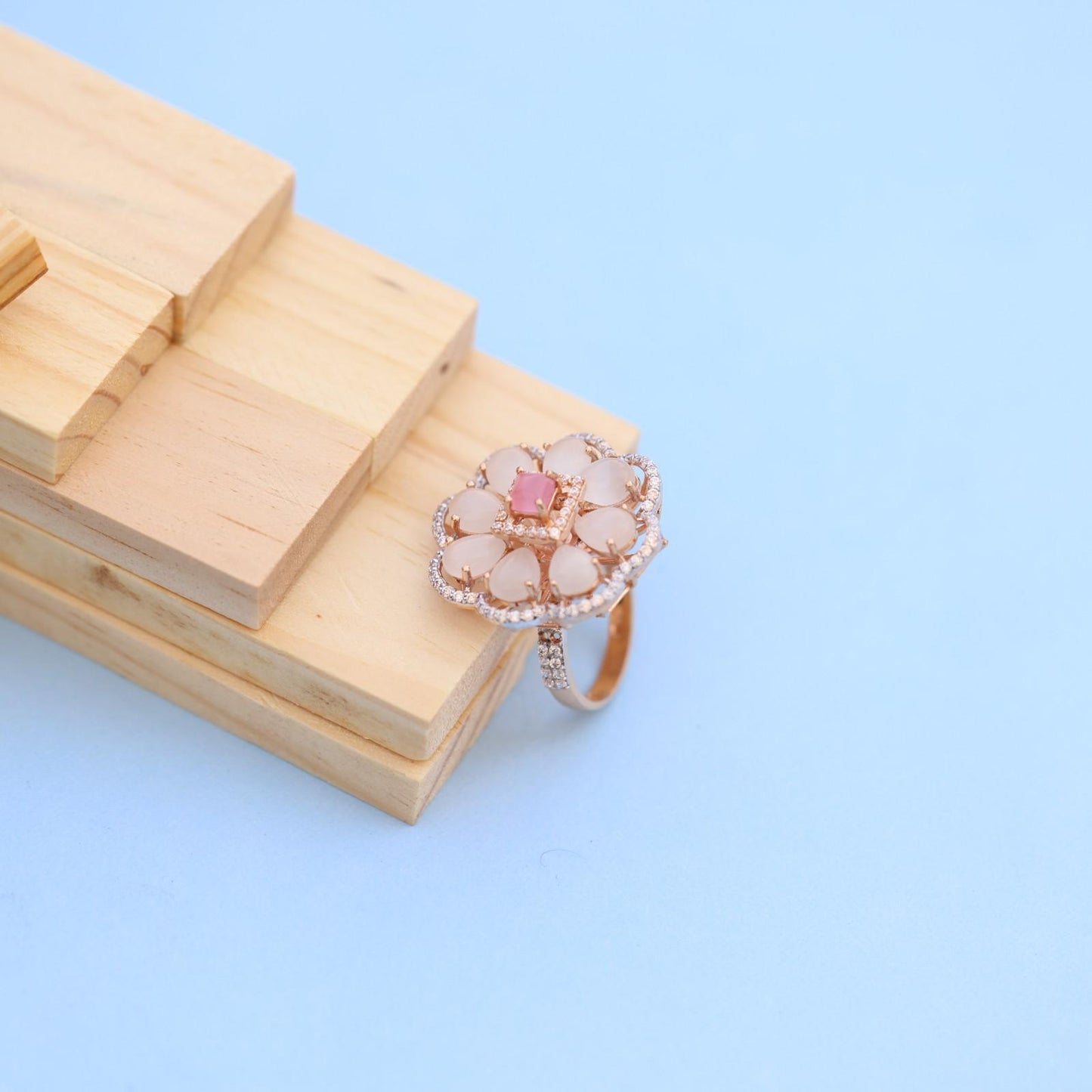 "Elegant Rose Gold Floral Ring with Pink Gemstone & White Accents"