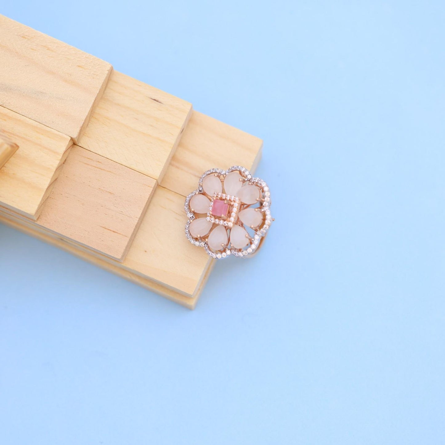 "Elegant Rose Gold Floral Ring with Pink Gemstone & White Accents"