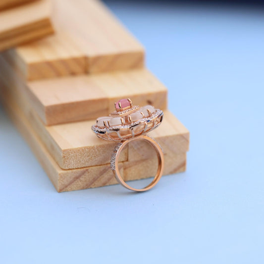 "Elegant Rose Gold Floral Ring with Pink Gemstone & White Accents"