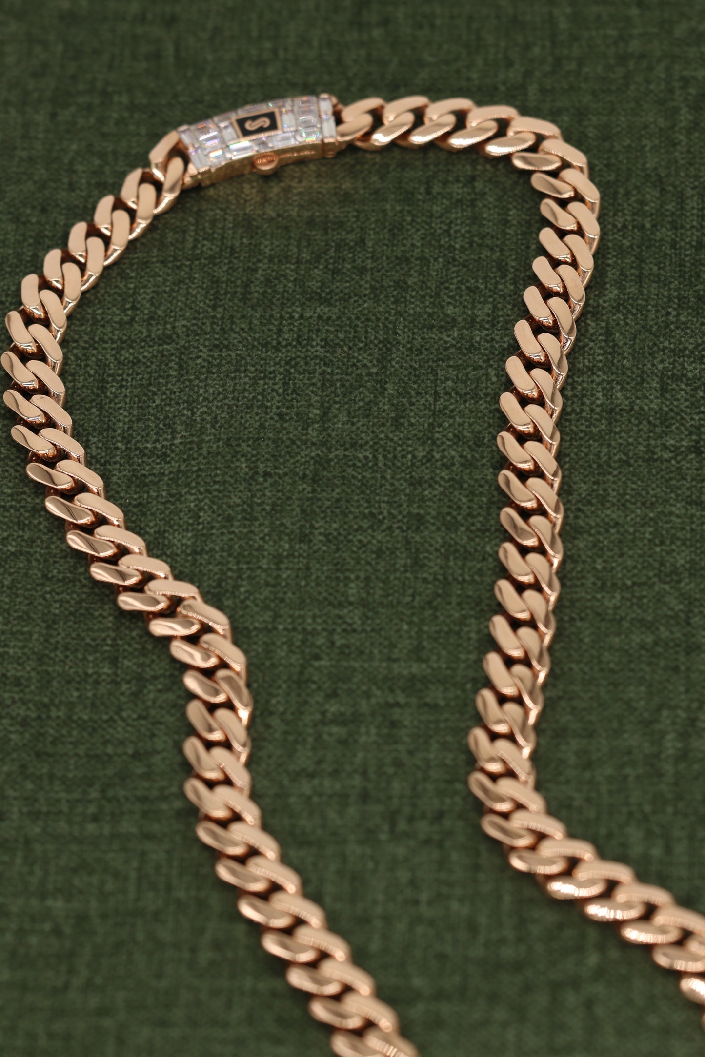 Luxurious Rose Gold Cuban Link Bracelet with Signature Diamond Lock