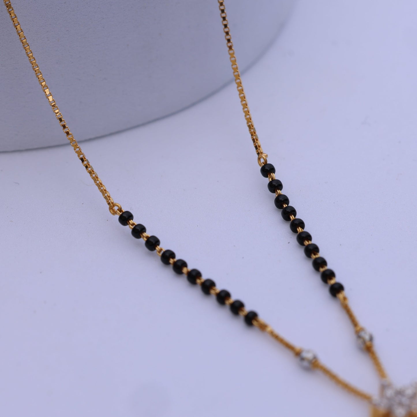 Gold Mangalsutra with American Diamond Pendant