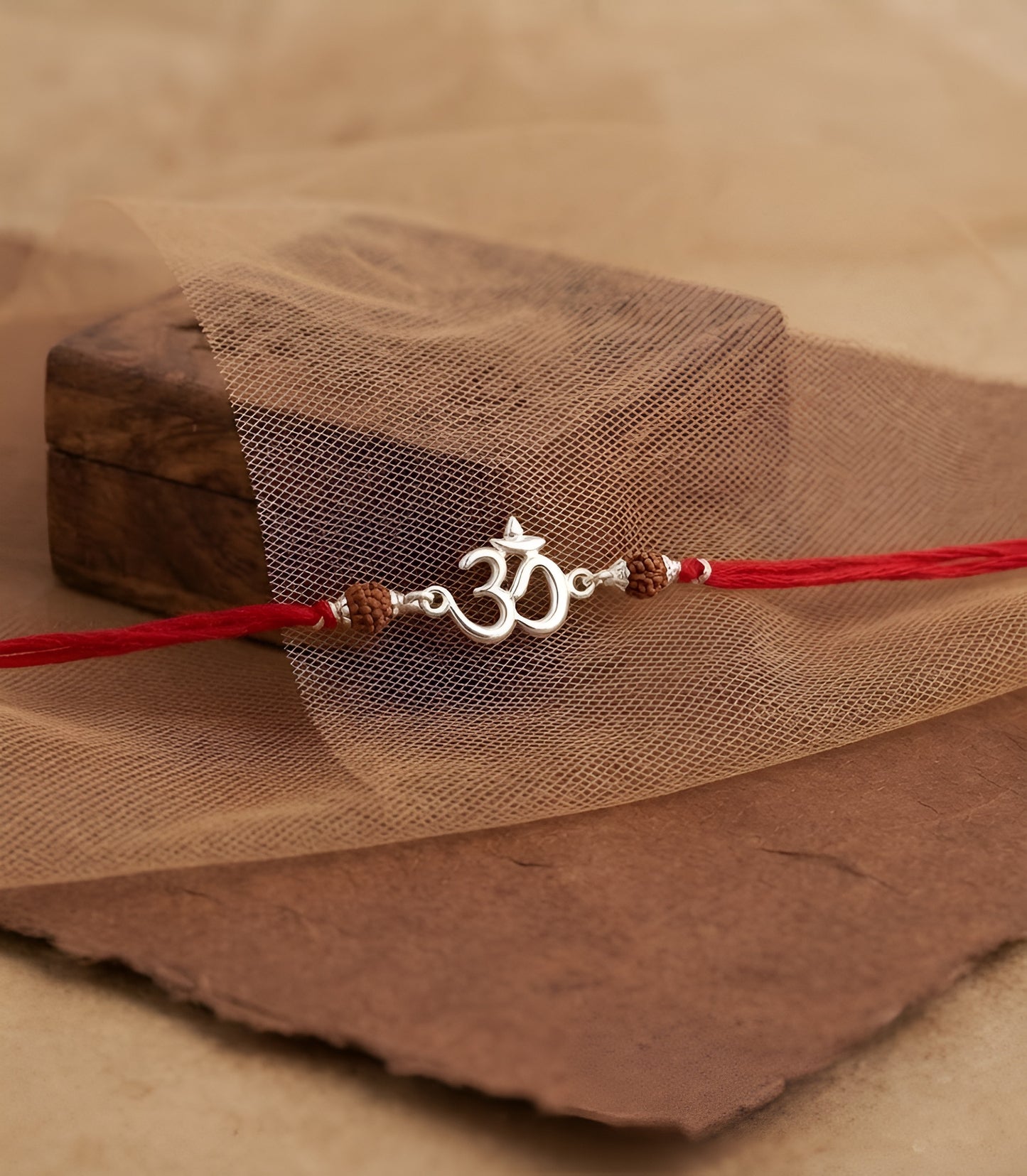 Divine Om Silver Rakhi with Natural Rudraksha Beads