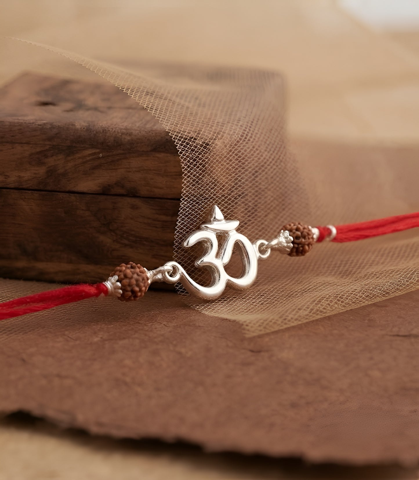 Divine Om Silver Rakhi with Natural Rudraksha Beads