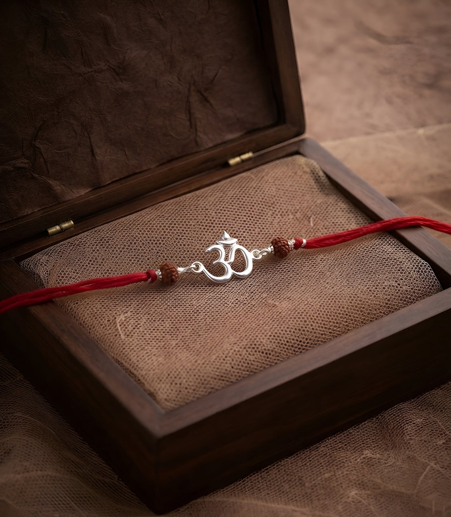Divine Om Silver Rakhi with Natural Rudraksha Beads