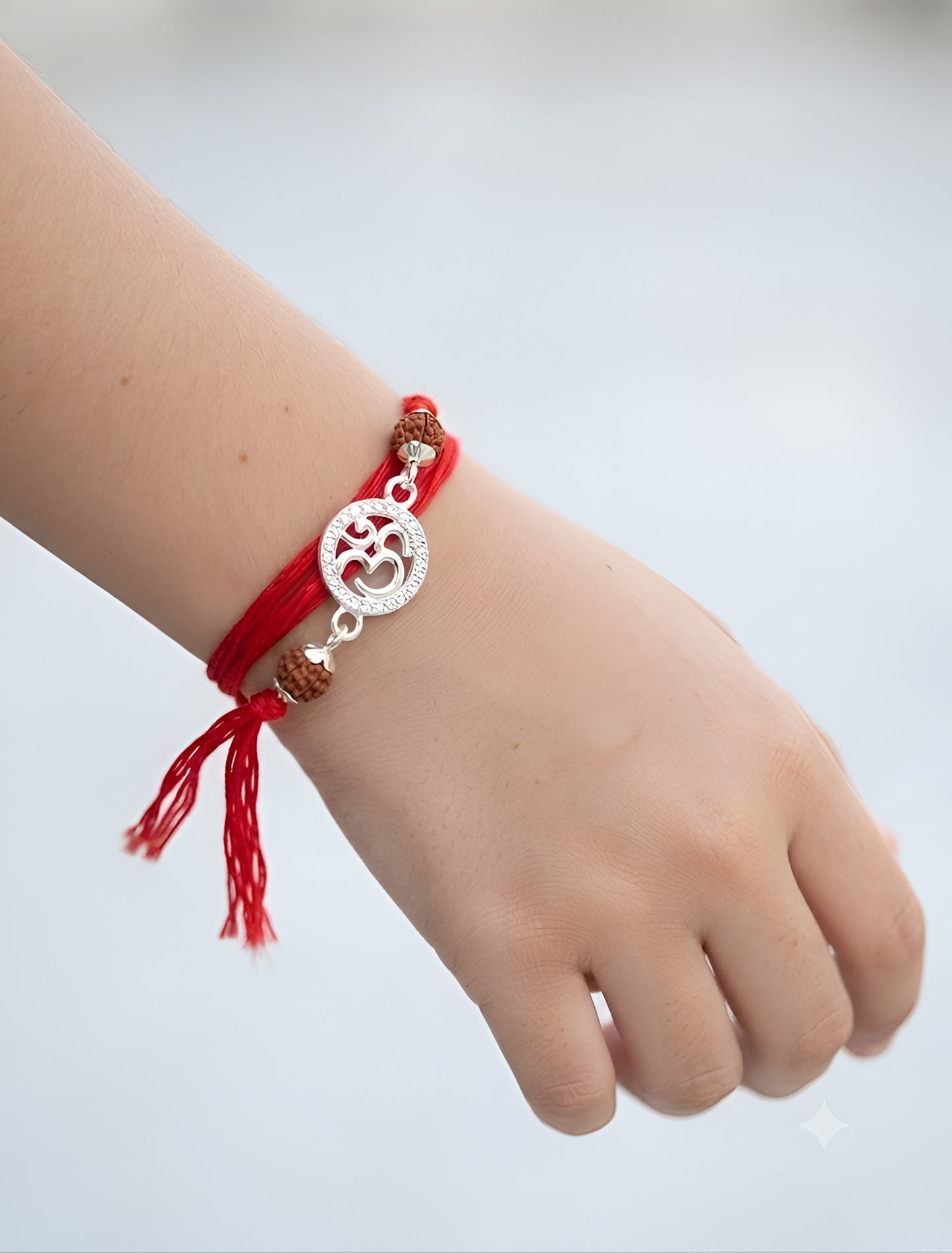 Sacred Om Silver Rakhi with Rudraksha Beads