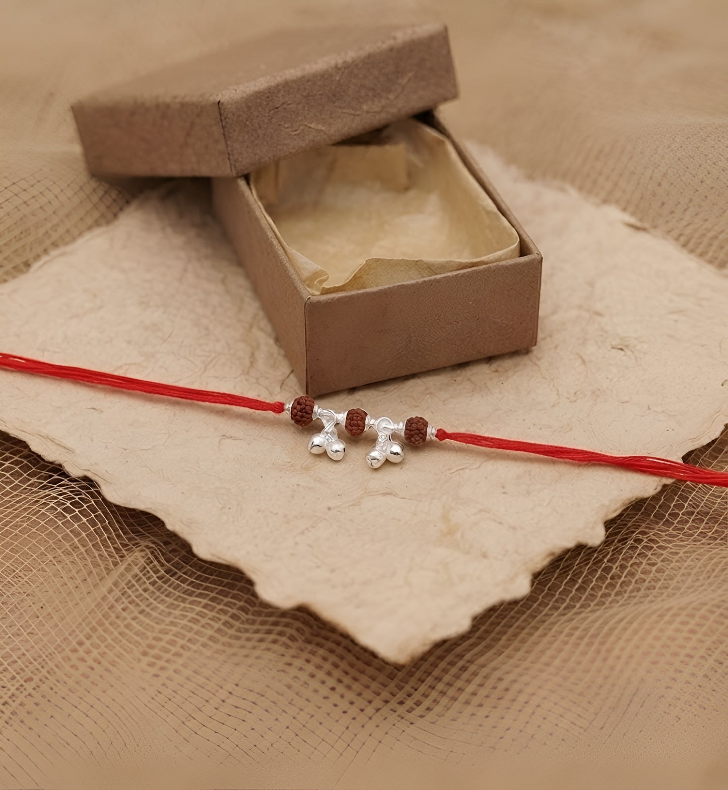 Elegant Rudraksha Silver Ghungroo Rakhi for Sister-in-Law
