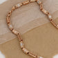 Luxurious Rose Gold Necklace with Greek Key Design and Micro-Pave Diamond Detailing